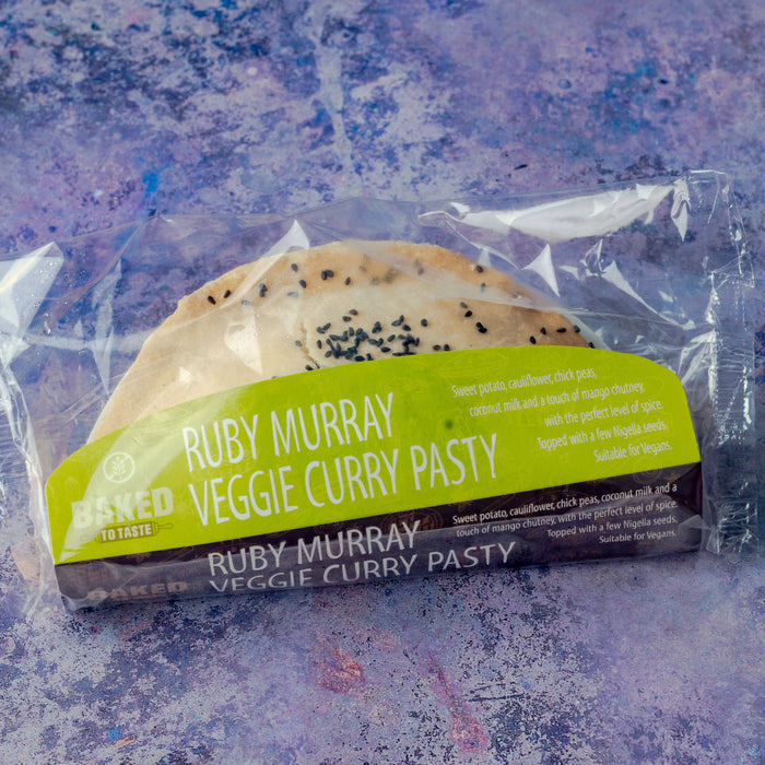 Gluten free curry pasty wrapped in brightly coloured packaging