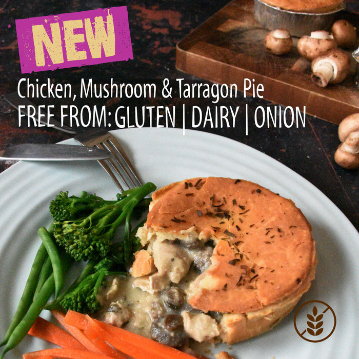 Chicken, mushroom tarragon pie served with broccoli and carrots on a plate